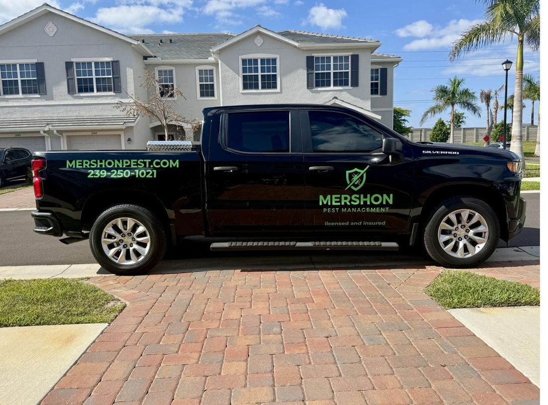 Mershon Pest Management truck parked in a Naples driveway
